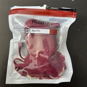 Maroon airpods case with keychain poof
